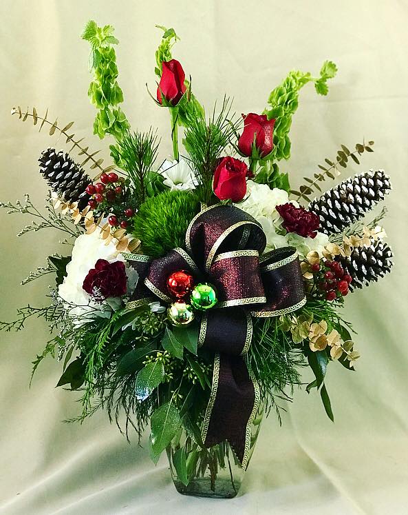 Seasonal Christmas arrangement with pinecones